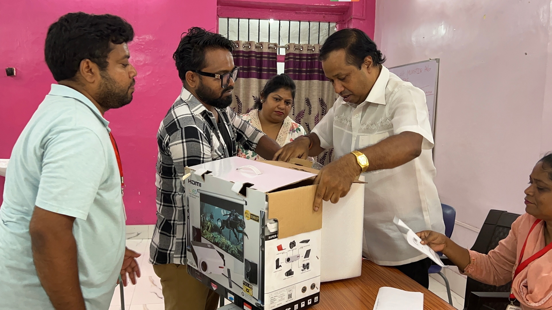 Volunteers handing over donated supplies