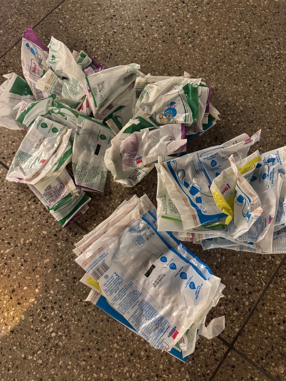 Cleaned milk pouches gathered on the floor