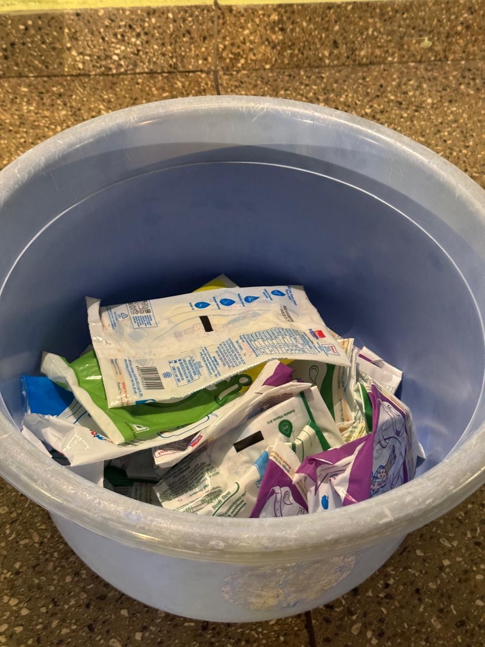 Collection bucket filled with milk pouches