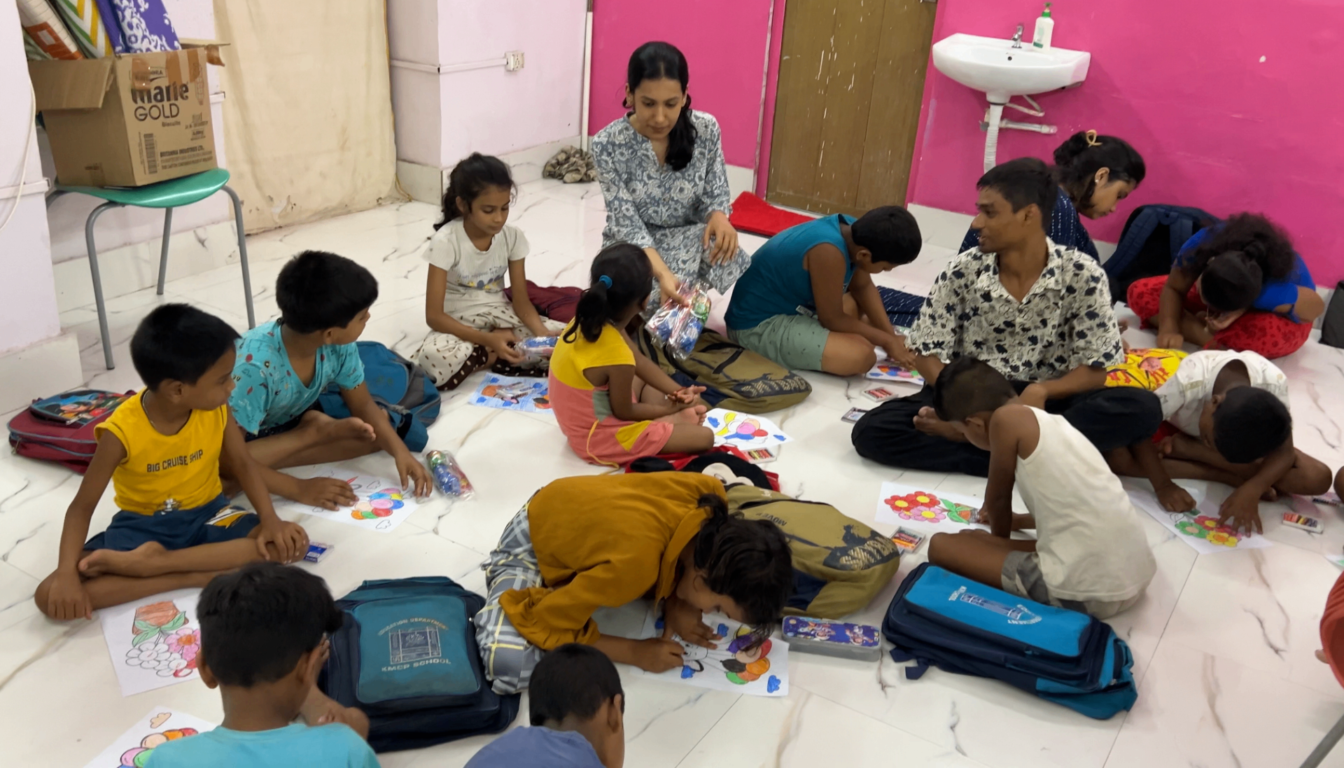 Children colouring together during the drive