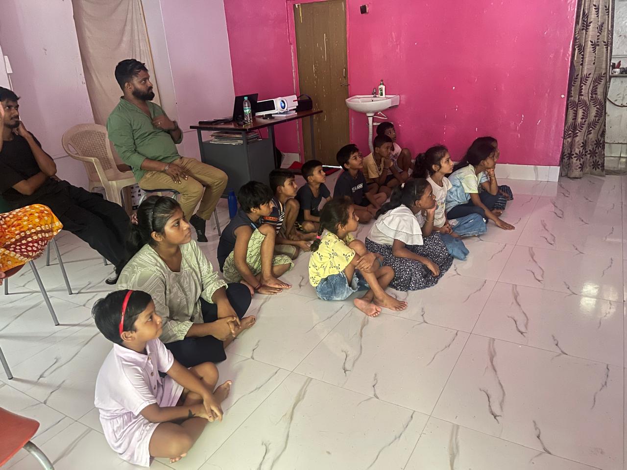 Children in class watching the projector